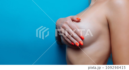 Big Breasts of a sexy woman, close up. Plastic correction and surgery concept. Big Breasts of a sexy woman, close up. Plastic correction and surgery concept. 109298415
