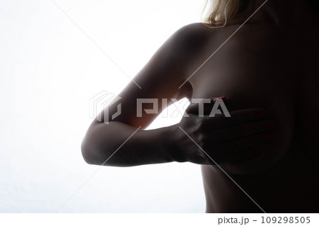 Big Breasts of a sexy woman, close up. Plastic correction and surgery concept. silhouette on a white background Big Breasts of a sexy woman, close up. Plastic correction and surgery concept. silhouette on a white background 109298505