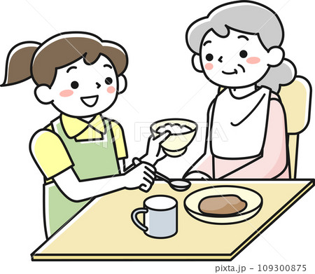 座って食事をするシニア女性と介助する女性職員 109300875