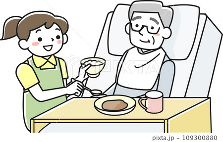 ベッドで食事をするシニア男性と介助する女性職員 109300880