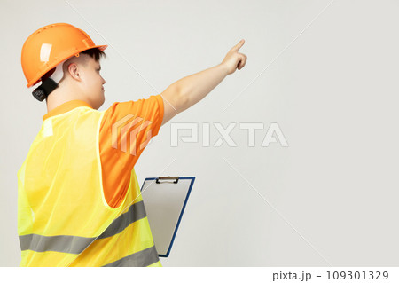 PNG, boy with down syndrome in work uniform with hard hat on his head, isolated on white background PNG, boy with down syndrome in work uniform with hard hat on his head, isolated on white background 109301329