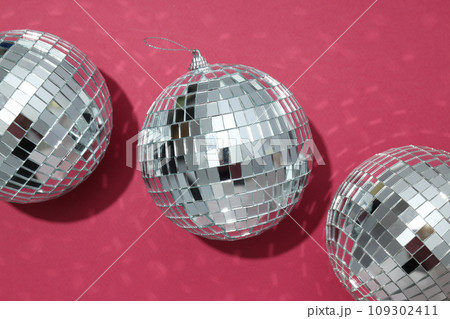 Beautiful disco balls on a red background 109302411