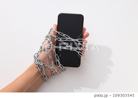 The smartphone is encased in a chain with a lock 109303545