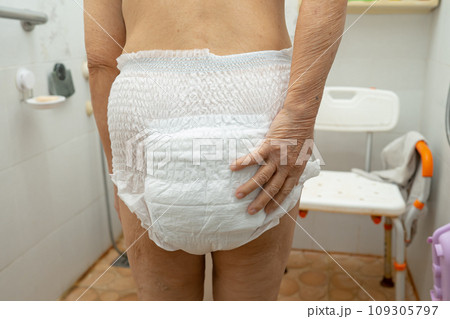 Asian senior woman patient wearing incontinence diaper in hospital, healthy strong medical concept. Asian senior woman patient wearing incontinence diaper in hospital, healthy strong medical concept. 109305797