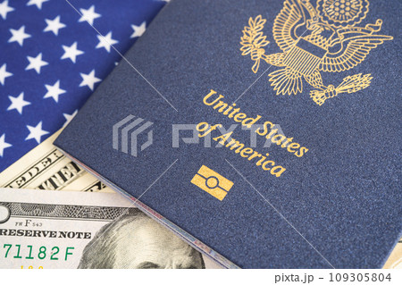 US passport issued to citizen and national of the United States of America to travel in most countries outside with USA flag and dollar money. US passport issued to citizen and national of the United States of America to travel in most countries outside with USA flag and dollar money. 109305804