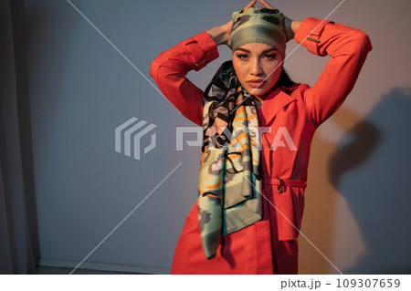 Portrait of a beautiful fashionable young woman in red clothes Portrait of a beautiful fashionable young woman in red clothes 109307659