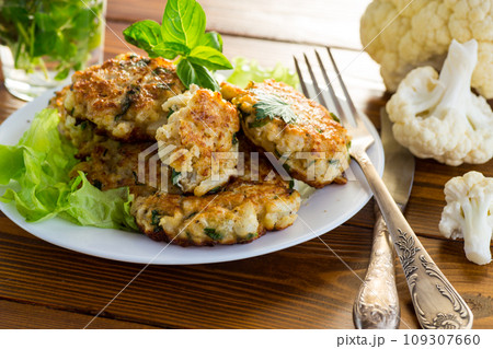 cooked vegetarian fried cauliflower cutlets in a plate cooked vegetarian fried cauliflower cutlets in a plate 109307660