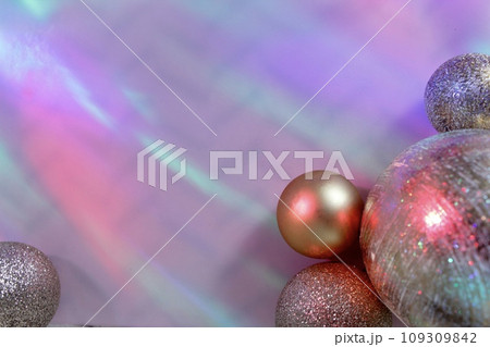 christmas balls on a background of colored lights and bokeh. 109309842