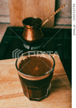 Drinking Turkish Coffee Boiled in Pot 109310799