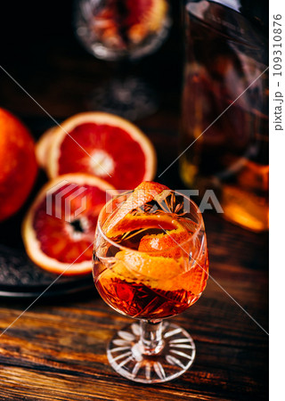 Glass of orange whiskey sour cocktail Glass of orange whiskey sour cocktail 109310876