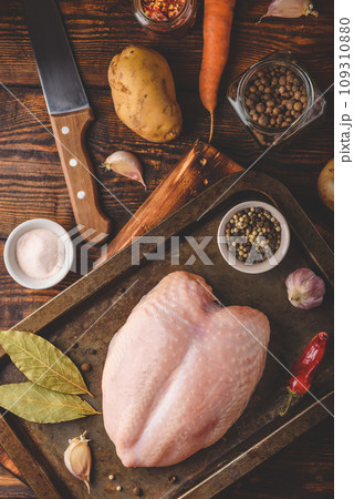 Raw chicken breast with spices 109310880