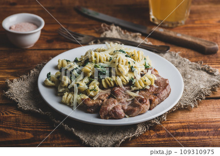 Pork Steak and Creamy Spinach Pasta 109310975