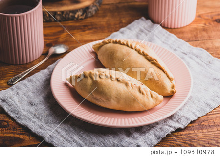 Oven Baked Cabbage Pies on Plate. Oven Baked Cabbage Pies on Plate. 109310978