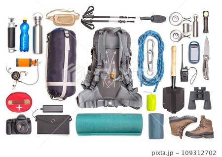 Set of tourist trekking items on white background. Top view of accessories for travel. Set of tourist trekking items on white background. Top view of accessories for travel. 109312702
