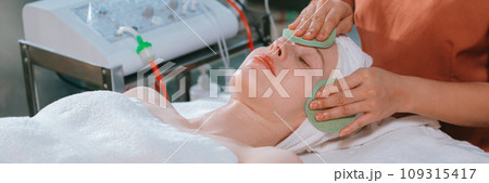 Attractive caucasian woman receive electrical facial treatment. Tranquility. 109315417