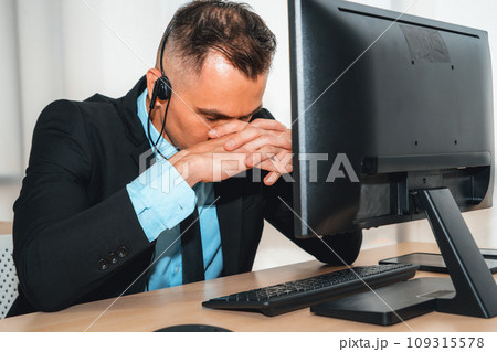 Business people wearing headset feel unhappy working in office Jivy Business people wearing headset feel unhappy working in office Jivy 109315578