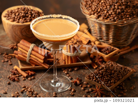 Chocolate martini cocktail or Irish cream liquor on a brown background. Chocolate martini cocktail or Irish cream liquor on a brown background. 109321021