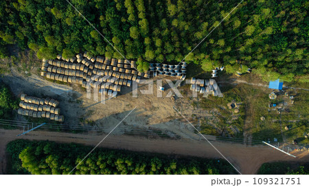 Wooden Coils of Electrical wires at outdoor construction site. High voltage cable roll. 109321751