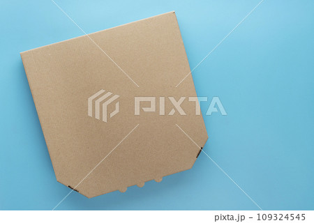 Pizza closed carton box on uniform blue background flat lay mockup with blank space Pizza closed carton box on uniform blue background flat lay mockup with blank space 109324545