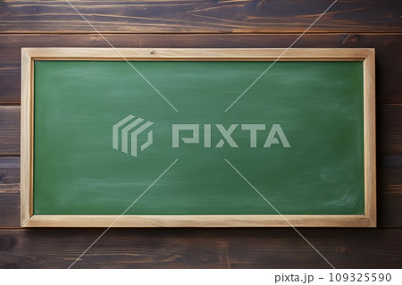 blank green chalkboard with wood border on wooden background, education and commercial concept, text space. blank green chalkboard with wood border on wooden background, education and commercial concept, text space. 109325590