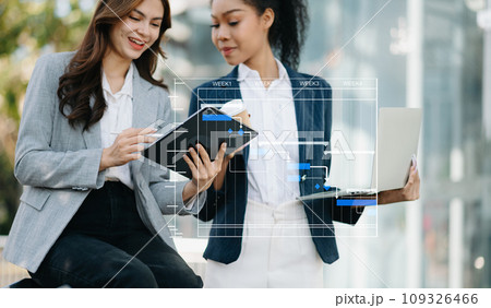 Project manager working and update tasks with milestones progress planning and Gantt chart scheduling diagram. business working with smart phone, tablet and laptop in office. Project manager working and update tasks with milestones progress planning and Gantt chart scheduling diagram. business working with smart phone, tablet and laptop in office. 109326466