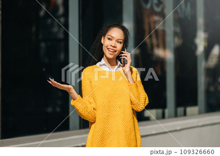 Working woman concept a female manager attending video conference and holding tablet, smatrphone and cup of coffee on street in city Outside . Working woman concept a female manager attending video conference and holding tablet, smatrphone and cup of coffee on street in city Outside . 109326660