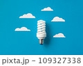 Light bulb with white cut out clouds. Idea concept 109327338