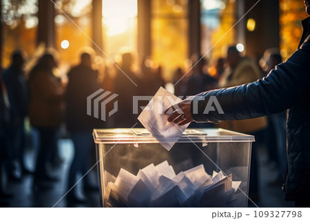 A man puts a ballot in a ballot box, close-up, voting and elections of candidates defending the rights of citizens and positive changes in the country, democratic reforms 109327798