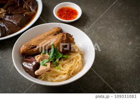 dried noodles with braised duck in white bowl dried noodles with braised duck in white bowl 109331081