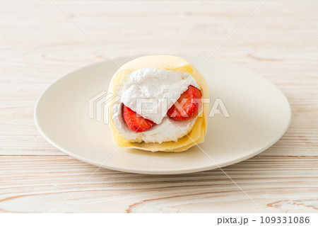 fresh strawberry cream crepe on plate 109331086