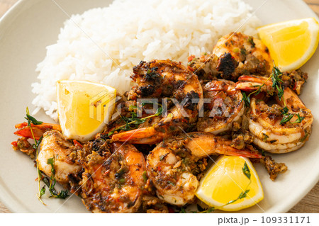 jerk shrimps or grilled shrimps in Jamaica style with rice 109331171