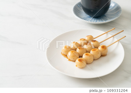 Mitarashi dango. Dumpling in a sweet soy sauce Mitarashi dango. Dumpling in a sweet soy sauce 109331204