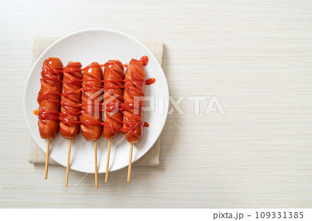 fried sausage skewer with ketchup 109331385