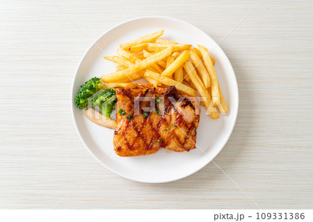 grilled chicken steak with potato chips or french fries 109331386
