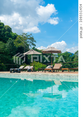 bed pool with umbrella around swimming pool bed pool with umbrella around swimming pool 109331454