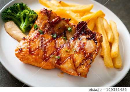 grilled chicken steak with potato chips or french fries grilled chicken steak with potato chips or french fries 109331486