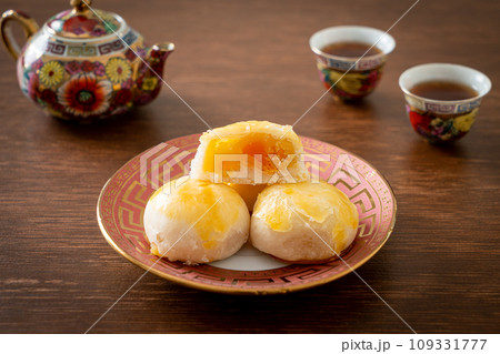 Chinese pastry moon cake with salted egg peanut or Spring Roll pastry with nuts and salted eggs Chinese pastry moon cake with salted egg peanut or Spring Roll pastry with nuts and salted eggs 109331777