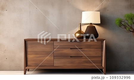 Brown wooden chest of drawers against a concrete wall. Brown wooden chest of drawers against a concrete wall. 109332996