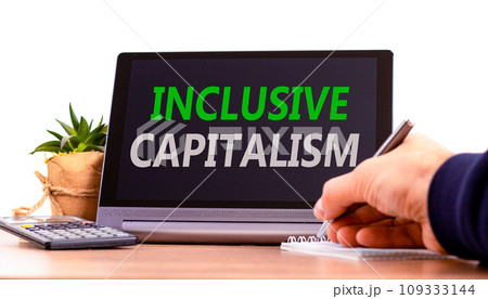 Inclusive capitalism symbol. Concept words Inclusive capitalism on beautiful black tablet. Beautiful white background. Calculator. Businessman hand. Business inclusive capitalism concept. Copy space. 109333144
