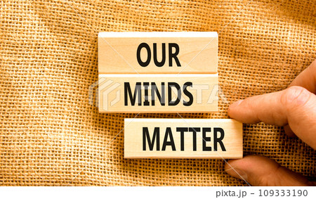 Our minds matter ourmindsmatter symbol. Concept words Our minds matter on wooden block. Beautiful canvas table canvas background. Businessman hand. Our minds matter ourmindsmatter concept. Copy space. 109333190