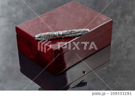 Fountain pen on marble and gray background. Gift concept. Fountain pen on marble and gray background. Gift concept. 109333291