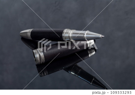 Fountain pen on marble and gray background. Gift concept. Fountain pen on marble and gray background. Gift concept. 109333293