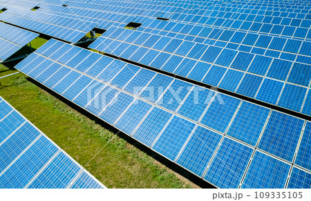 Aerial view of Solar Panels Farm Solar Cell Station. Production of clean energy. Renewable green alternative energy concept. Aerial view of Solar Panels Farm Solar Cell Station. Production of clean energy. Renewable green alternative energy concept. 109335105