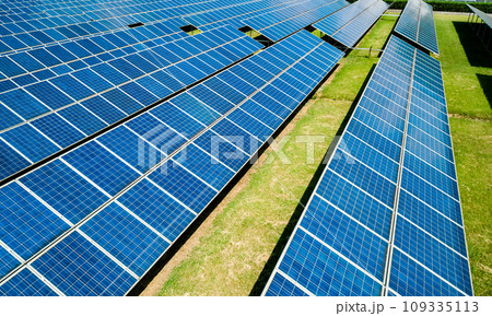 Aerial view of Solar Panels Farm Solar Cell Station. Production of clean energy. Renewable green alternative energy concept. Aerial view of Solar Panels Farm Solar Cell Station. Production of clean energy. Renewable green alternative energy concept. 109335113