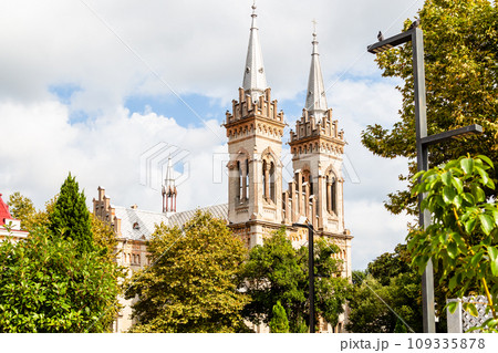 view of towers of Batumi Cathedral over green tree view of towers of Batumi Cathedral over green tree 109335878