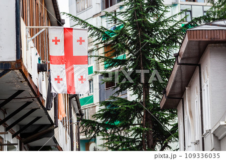 Georgian flag on balcony of residential building 109336035