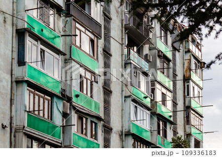 residential apartment building with green balcony 109336183