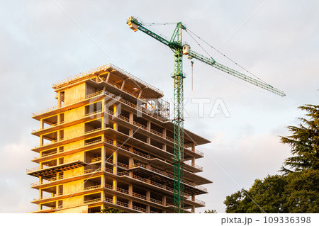 construction of high-rise building in twilight 109336398