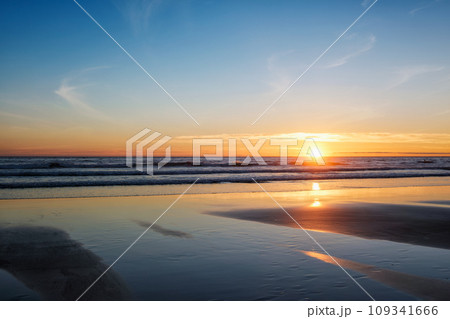 Atlantic ocean sunset with surging waves at Fonte da Telha beach, Costa da Caparica, Portugal 109341666