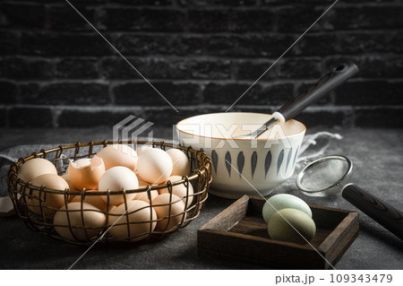 eggs in a bowl on a black background 109343479